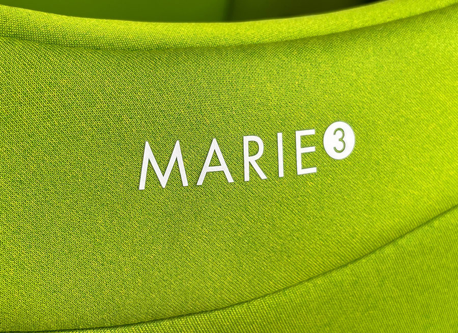 The latest generation of Swandoo's rotating car seat, Marie 3, in Lime Green