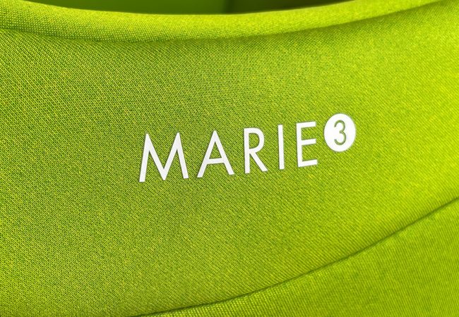 The latest generation of Swandoo's rotating car seat, Marie 3, in Lime Green